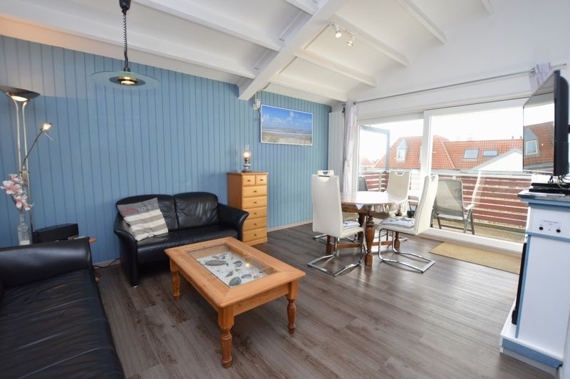 Spacious indoor area of Motel Texel - Apartment 315/1T, De Koog, Texel with dining area and terrace view.