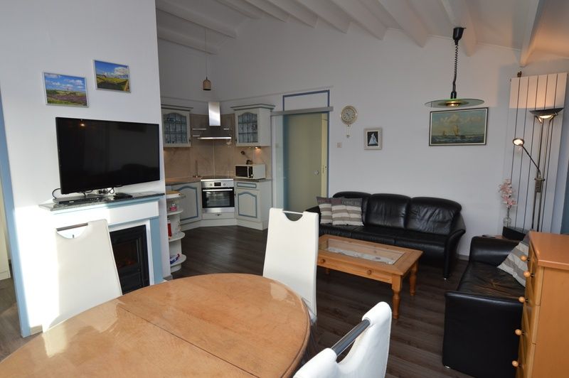 Open kitchen and living room in Motel Texel - Apartment 315/1T, De Koog, Texel, ideal for family stays.
