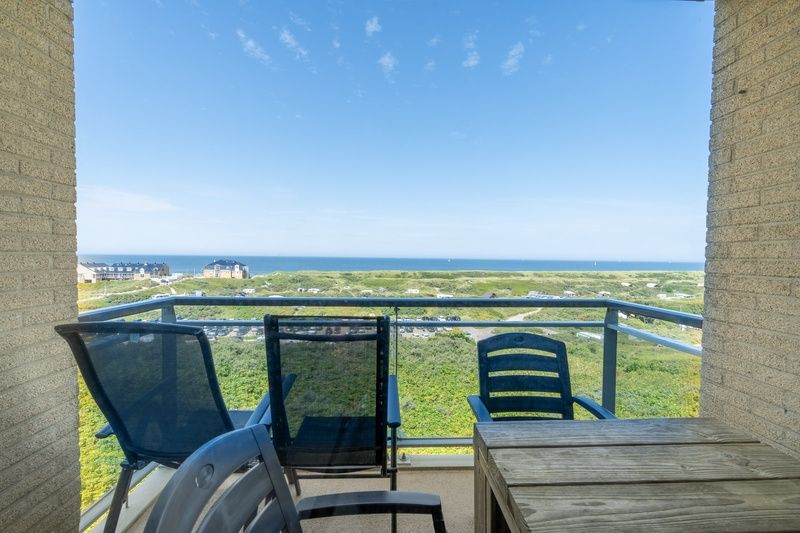 Prive balkon met spectaculair uitzicht op de kust bij Appartement Juliana 164 Zeezicht, De Koog.