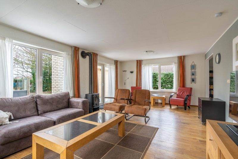 Bright and spacious living space in Holiday home Honeysuckle 43 with sauna, De Koog, Texel, overlooking the garden.