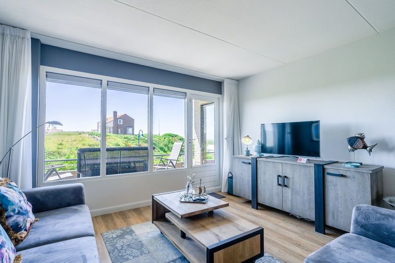 Stylish living room of Apartment Juliana 042 overlooking De Koog, Texel, ideal for a relaxing stay.