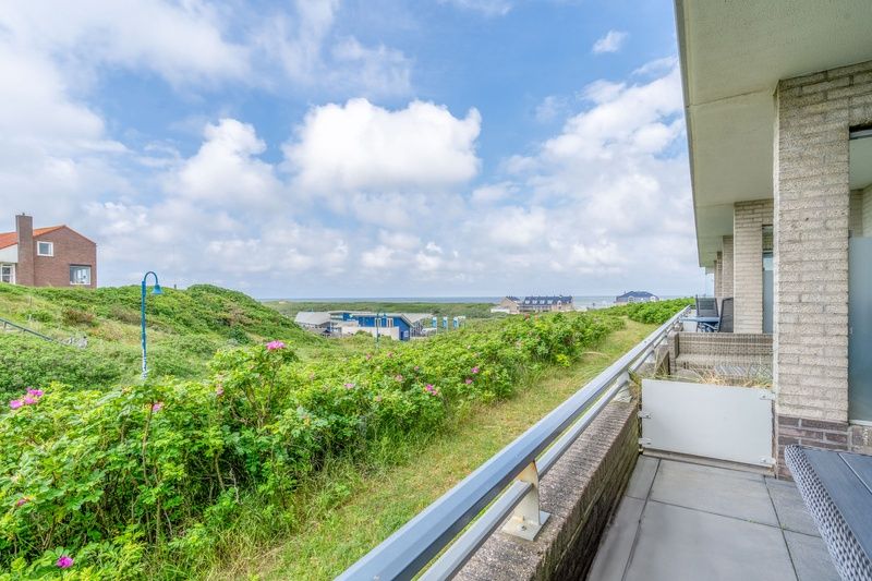 Balcony of Apartment Juliana 042, De Koog, Texel, with beautiful views of the sea and nature of the Wadden Islands.