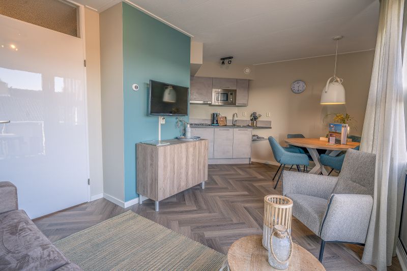 Open kitchen and dining area in Apartment Zeedistel 24, De Koog, Texel.