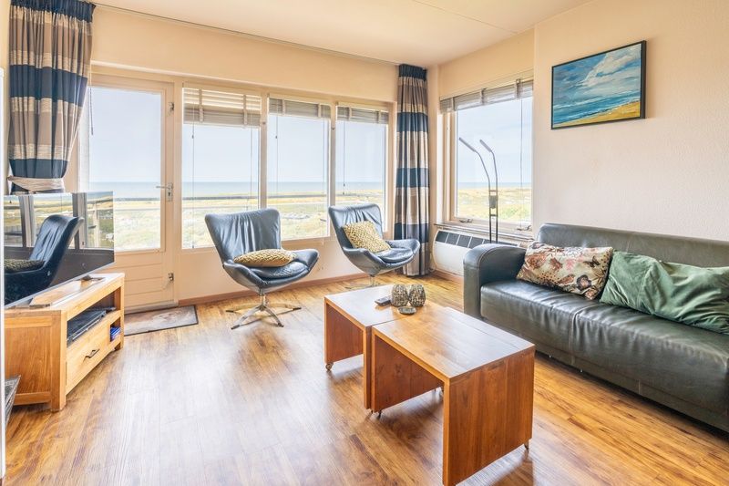 Bright living room of Apartment Juliana 168 Zeezicht, De Koog Texel, overlooking the dunes and sea.