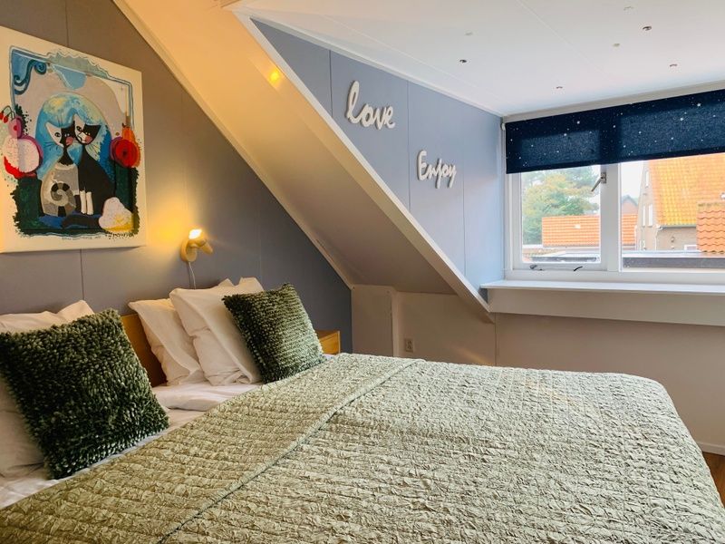 Bedroom in Texel A, De Koog, with views of the surroundings and cozy decoration.