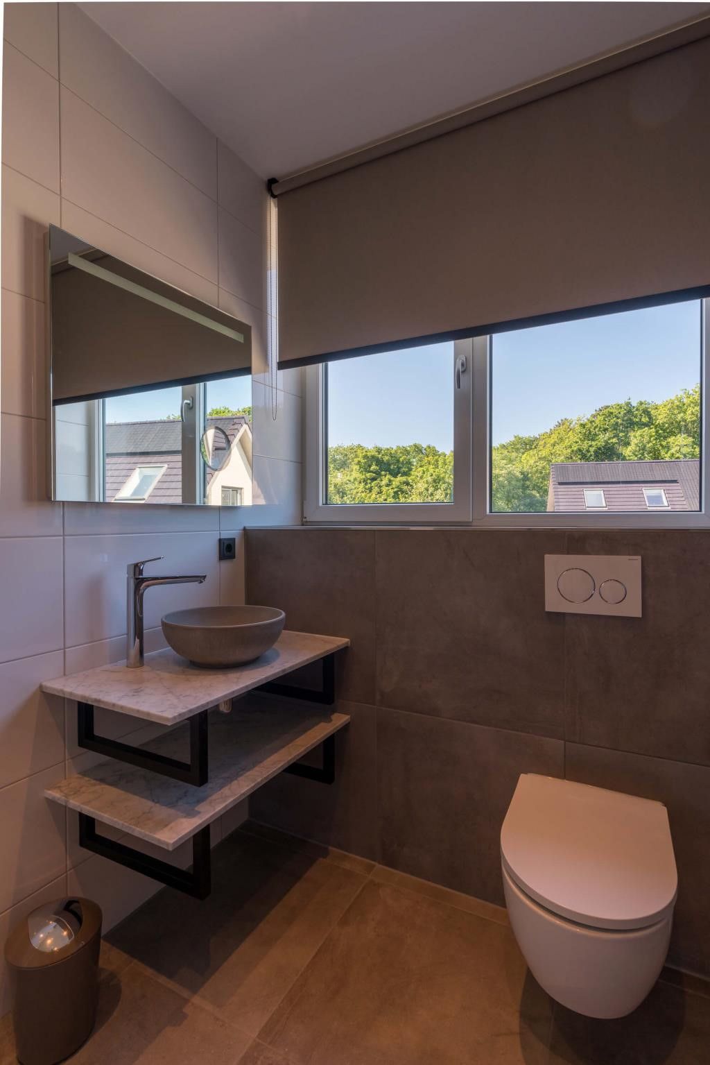 Bathroom with view in Kluut 16a vacation home in De Koog, Texel.