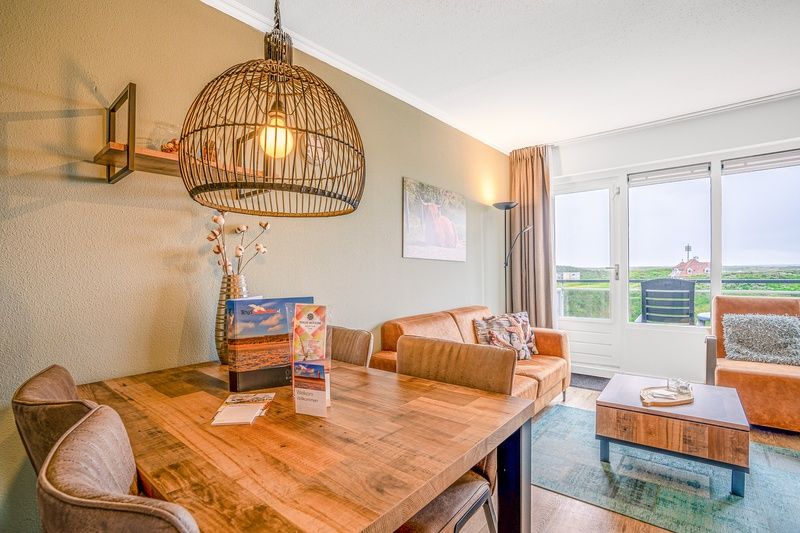 Dining area overlooking nature in Apartment Juliana 136 Island and Sea View, De Koog, Texel.
