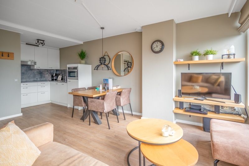 Dining area and kitchen in Apartment Juliana 178 Eilandzicht, De Koog, Texel, ideal for family dinners.