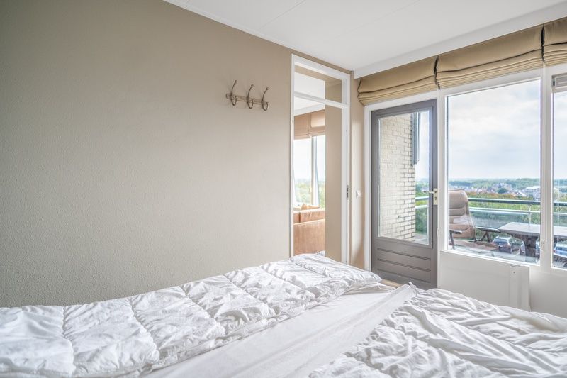 Bedroom with balcony and view in Apartment Juliana 178 Eilandzicht, De Koog, Texel.