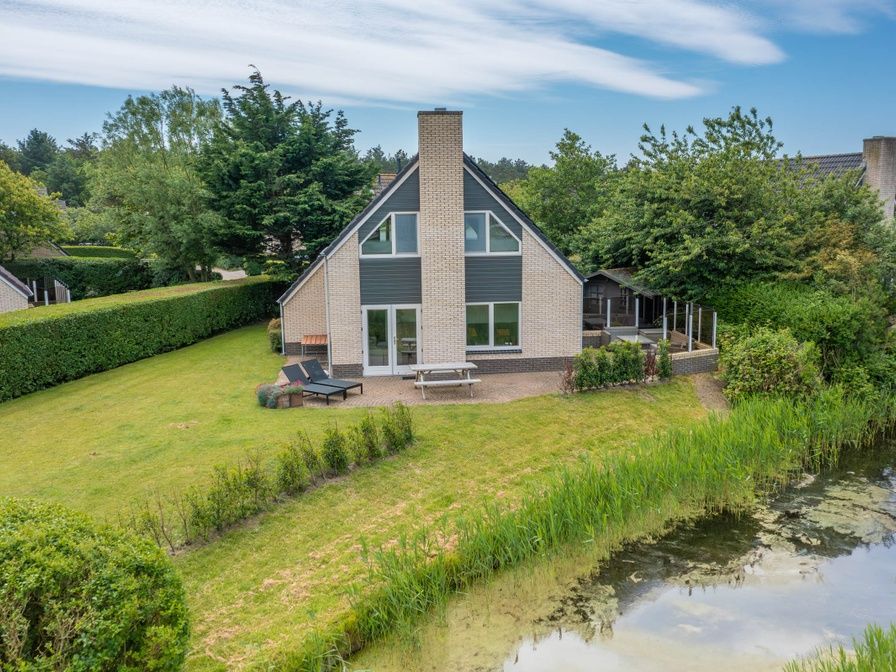 Vacation home Honeysuckle 71 in De Koog, Texel with spacious waterfront garden.