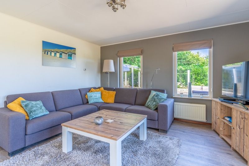 Cozy living room of Holiday home Kamperfoelie 71, De Koog, Texel with comfortable sofa.