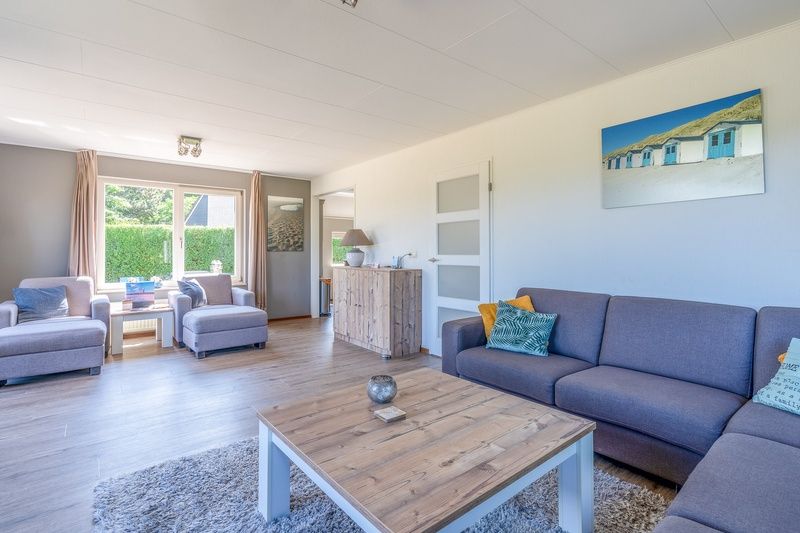 Bright interior of Holiday home Honeysuckle 71 in De Koog, Texel with modern furnishings.