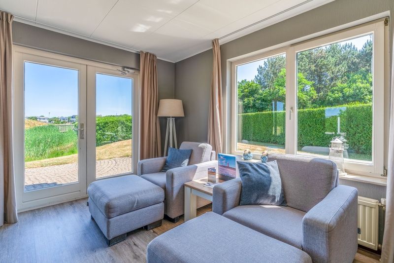 Sitting area overlooking the garden at Holiday home Honeysuckle 71, De Koog, Texel.
