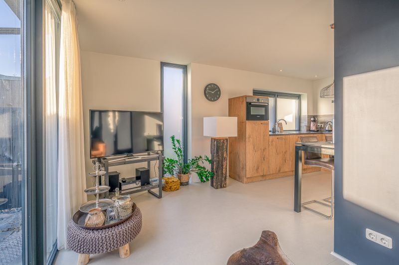 Modern kitchen and living room in Het Bospad - Brink 15, De Koog, Texel. Perfect for a comfortable stay on the Wadden Islands.