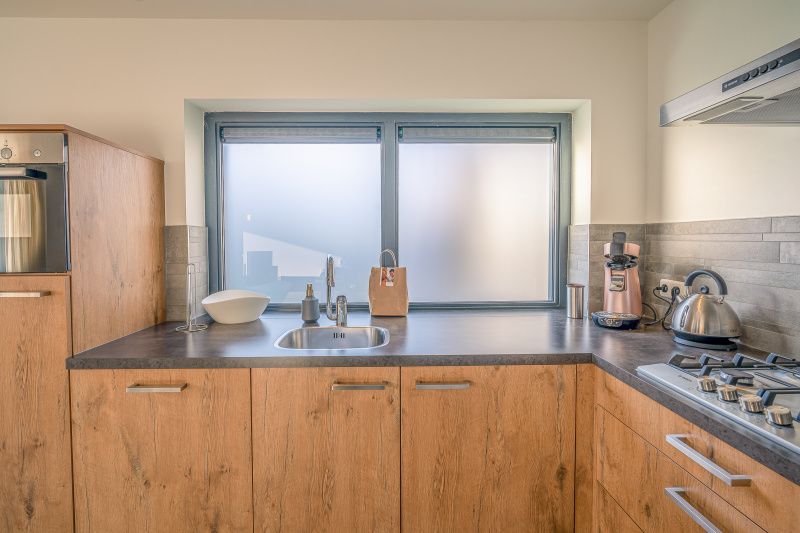 Modern kitchen in vacation home Het Bospad - Brink 15, De Koog, Texel. Fully equipped for a comfortable stay.
