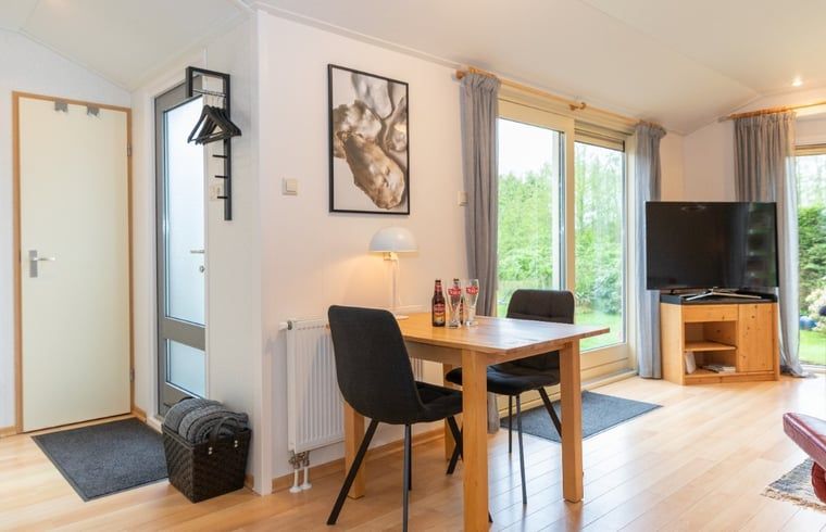 Dining area in Holiday home in De Koog with garden view, Texel, Wadden Islands.