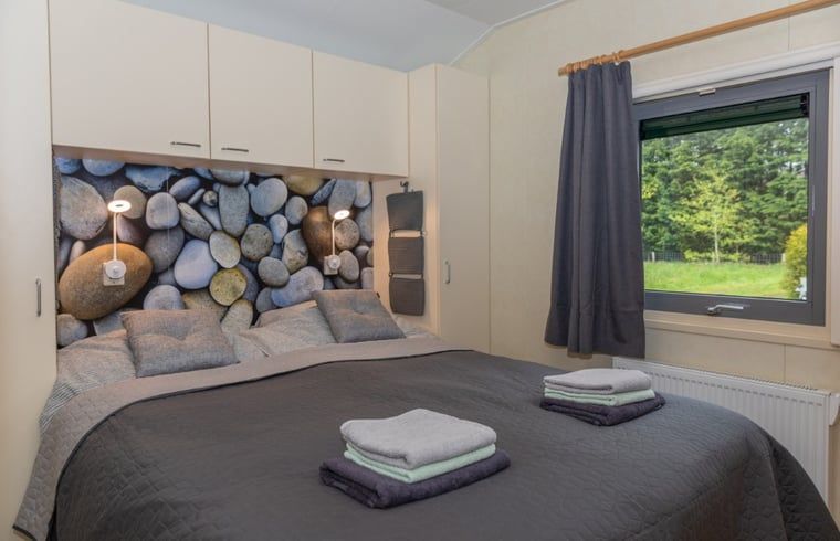 Comfortable bedroom with double bed in Holiday home in De Koog, Texel, Wadden Islands.