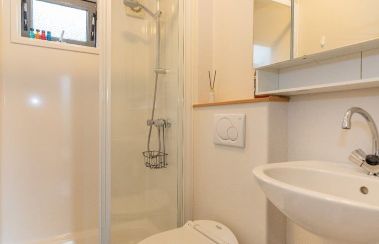 Modern bathroom with shower in Holiday home in De Koog, Texel, Wadden Islands.