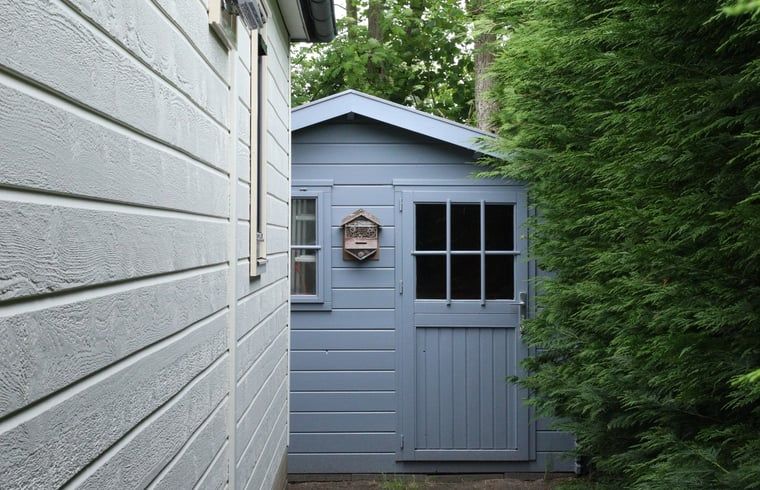 Blue garden house next to Holiday home in De Koog, for extra storage, Texel, Wadden Islands.