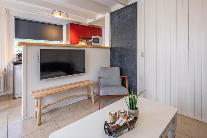Comfortable sitting room with large windows in 32b Pollux, De Koog, Texel.