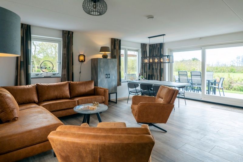 Cozy living room of Landhuis De Wije Blick, vacation home in De Koog, Texel, with comfortable seating area.