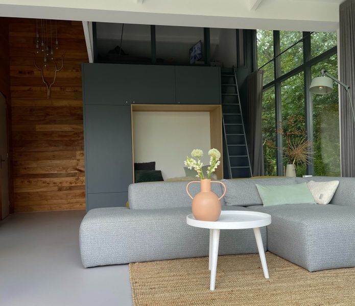 Stylish interior of De Koerie vacation home De Koog Texel with modern furniture and natural elements.