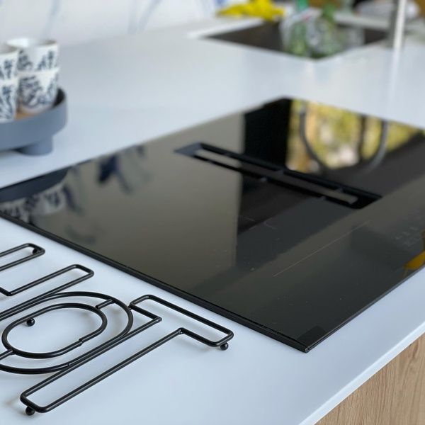 Sleek cooktop in De Koerie vacation home De Koog Texel kitchen, ideal for culinary adventures.
