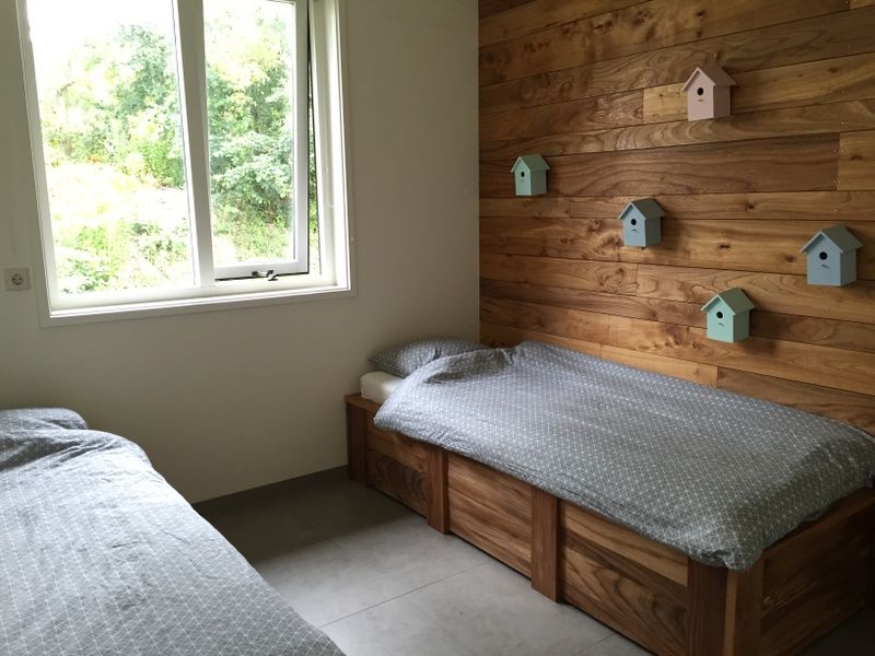 Rustic children's room in De Koerie vacation home De Koog Texel with wooden details and playful decoration.