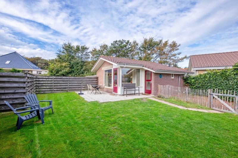 Spacious garden at Het Zandblauwtje vacation home in De Koog Texel