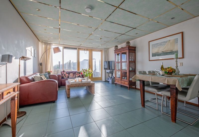 Spacious living space in Resort De Buteriggel - Apartment 9, De Koog, Texel with modern furnishings and lots of natural light.