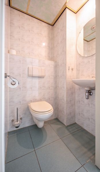 Guest toilet in Resort De Buteriggel - Apartment 9, De Koog, Texel with sleek and modern finish.