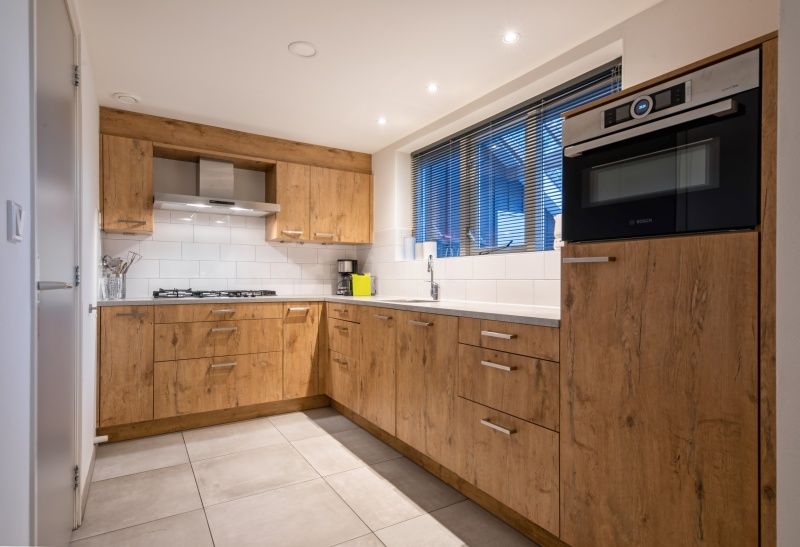 Fully equipped kitchen in Holiday Park Het Oude Dijkje - Vuurcoogh, De Koog, Texel for culinary adventures.