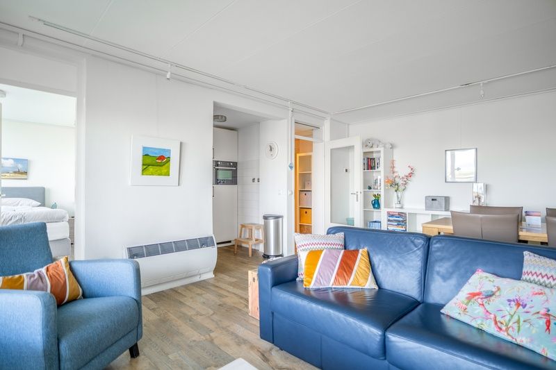 Spacious interior of Apartment Juliana 112 Zeezicht, De Koog, Texel with access to the kitchen and bedroom.
