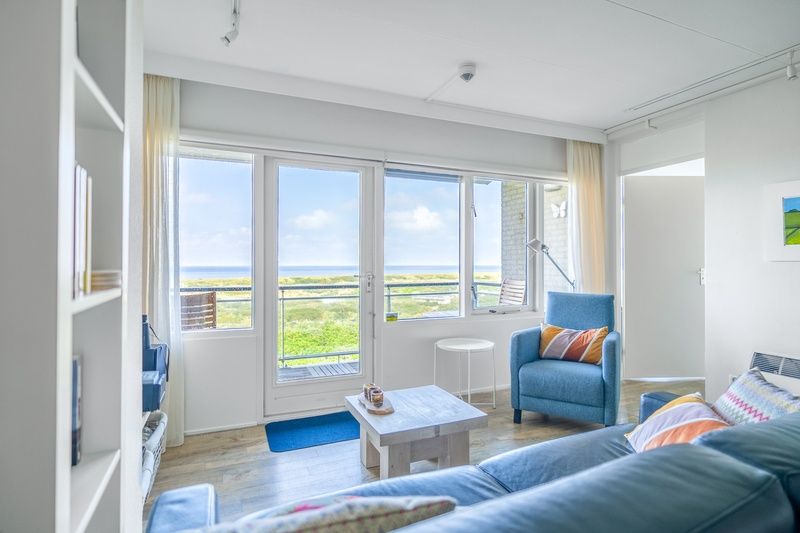 Bright living room of Apartment Juliana 112 Zeezicht in De Koog, Texel overlooking nature.