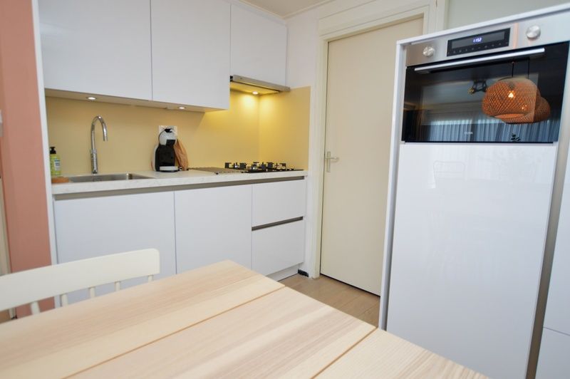 Modern kitchen in Apartments Anna - Sun, De Koog, Texel, with sleek finish and all necessary appliances.