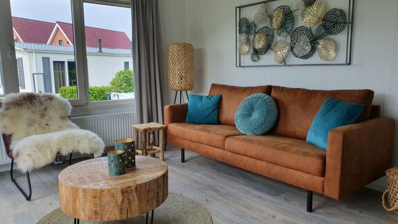 Stylish living room in Chalet Bregkoog 154, De Koog, Texel, with comfortable seating area.