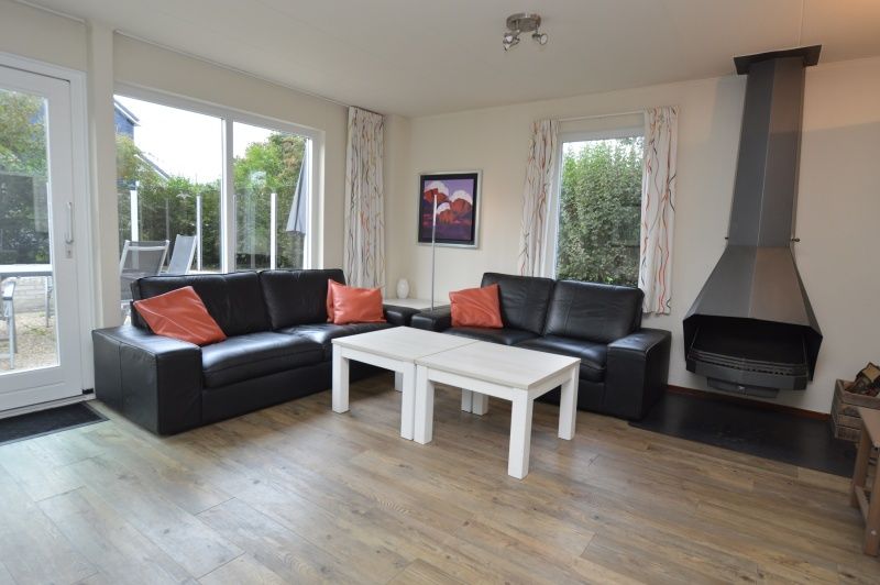 Cozy living room of Holiday home Stappeland 76 in De Koog, Texel with comfortable seating area.