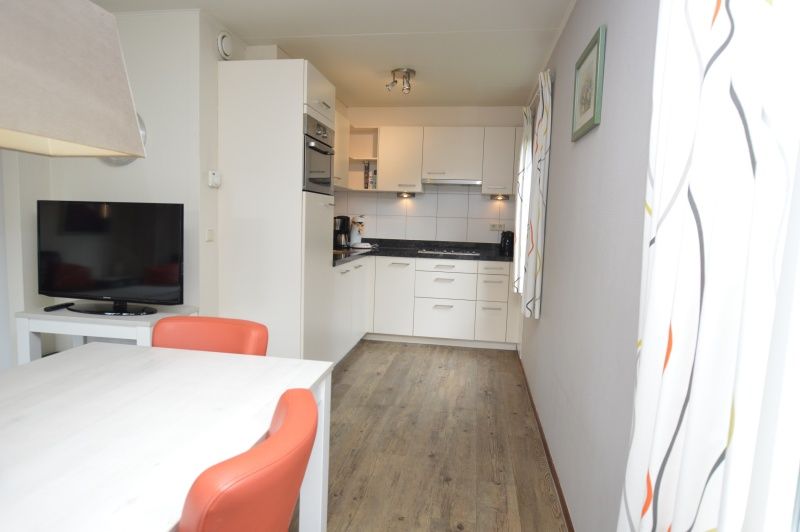 Open kitchen in Holiday home Stappeland 76, De Koog, Texel with modern appliances.