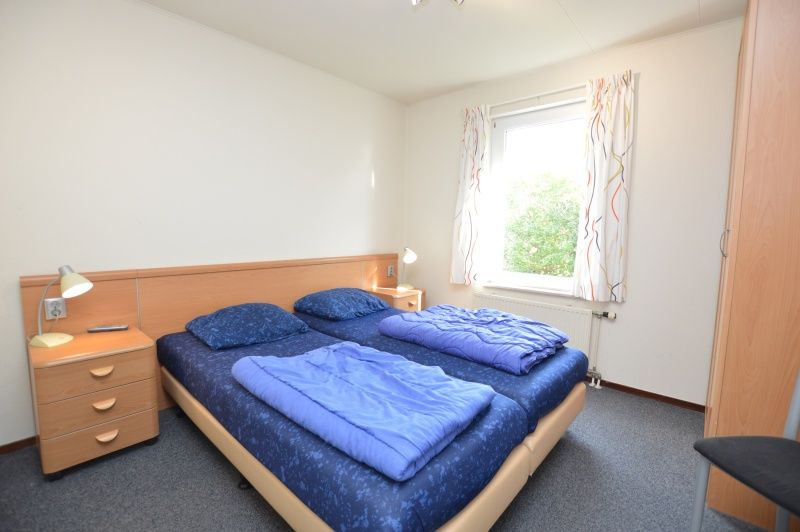 Bedroom in Holiday home Stappeland 76, De Koog, Texel with comfortable double bed.