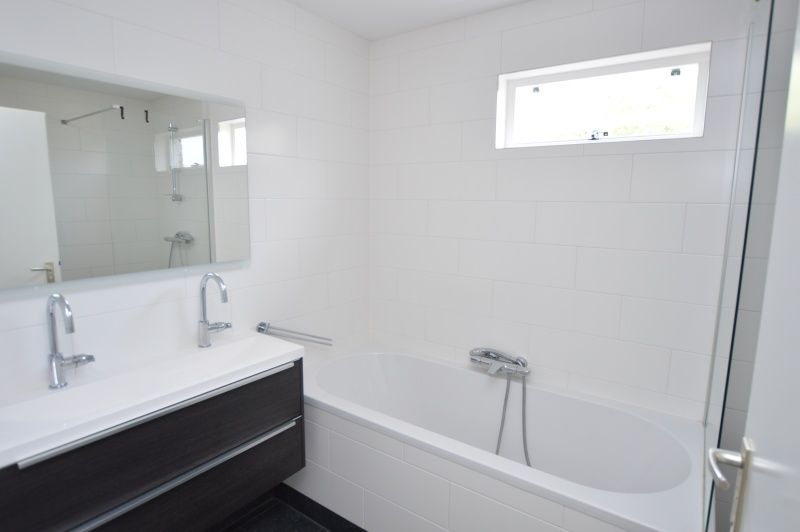 Luxury bathroom in Holiday home Stappeland 76, De Koog, Texel with modern amenities.