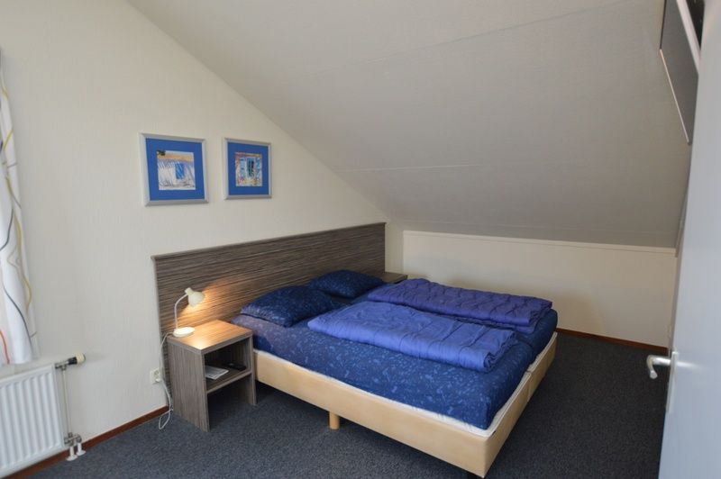 Cozy bedroom under sloping roof in Holiday home Stappeland 76, De Koog, Texel.