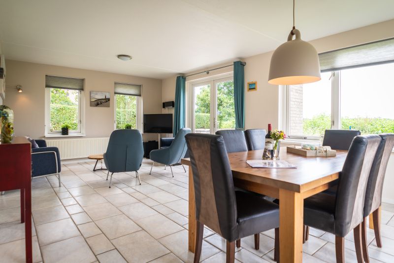 Dining area in Villa sleeps 6, De Koog, Texel. Enjoy meals overlooking the garden in this vacation home on the Wadden Islands.