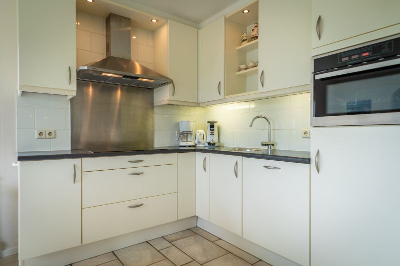 Fully equipped kitchen in Villa 6 persons, De Koog, Texel. Modern facilities for a comfortable stay on the Wadden Islands.