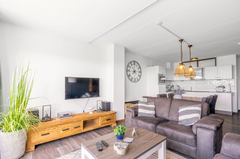 Open kitchen and living room in Apartment Juliana 094 Island and Sea View, De Koog, Texel with stylish decoration.