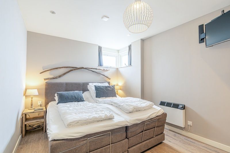 Comfortable bedroom with double bed in Apartment Juliana 034 Eilandzicht, De Koog, Texel.