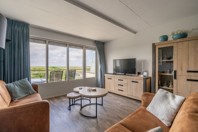 Gemuetliche Sitzecke im Apartment Juliana 096 Island and Sea View, De Koog, Texel mit Blick auf die Watteninseln.