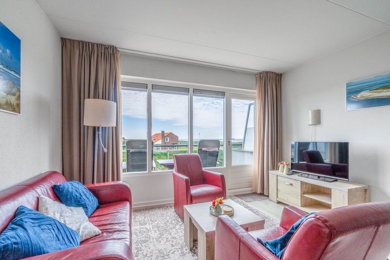 Bright living space of Apartment Juliana 138 in De Koog, Texel, with sea view.