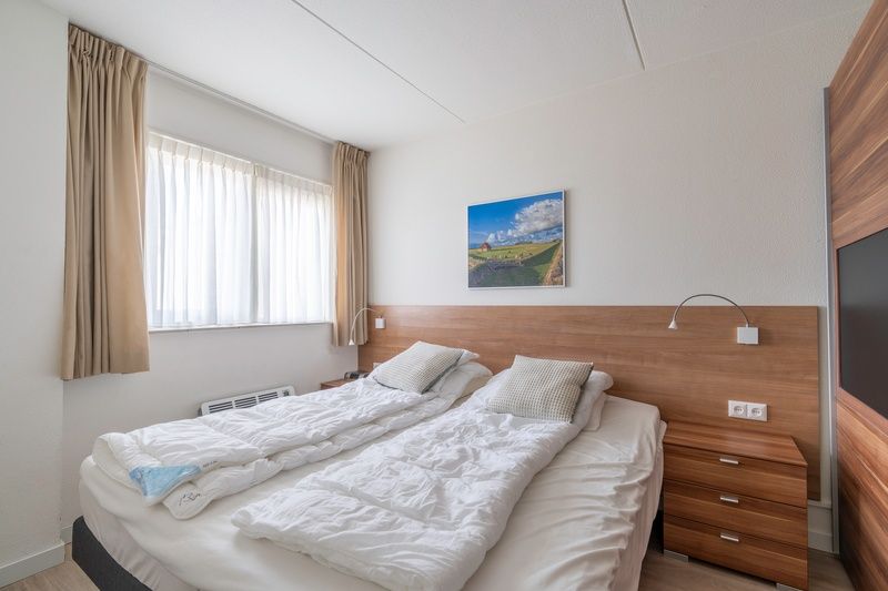 Attractive bedroom in Apartment Juliana 138, De Koog, Texel, with natural light.