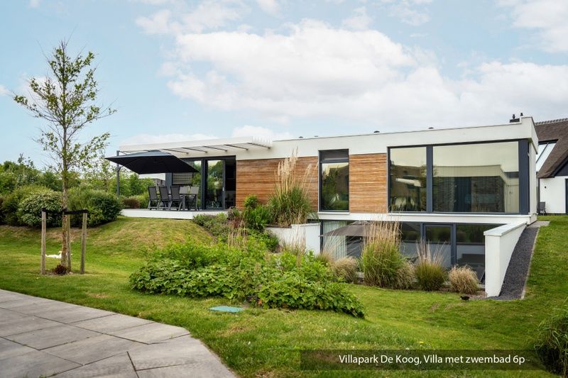 Luxury family villa with swimming pool in De Koog, Texel. Spacious indoor space overlooking the nature of the Wadden Islands.