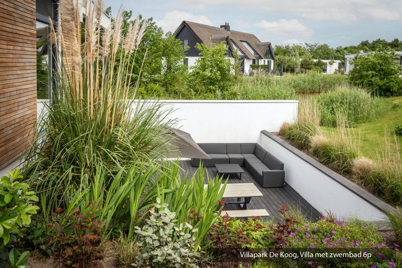 Luxury family villa with swimming pool in De Koog, Texel. Attractive sitting area for relaxation on the Wadden Islands.